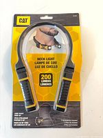 Front of sealed CAT CT7100 neck light package showing product and 200 lumens spec