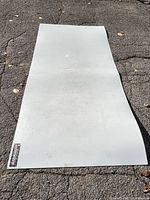 Full view of hockey shooting pad on pavement