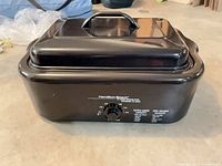 Hamilton Beach black roaster oven with lid attached