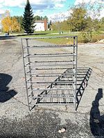 Front view of entire metal shelving unit outdoors