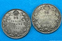 Both 25-cent coins reverse sides visible, dates 1928 and 1936