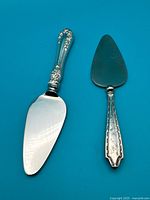 Both servers side by side on blue background showing full view