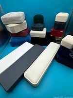 Group of assorted jewelry boxes in various colors and sizes