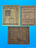 Group shot of all three colonial notes