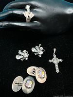 All five sterling silver pieces displayed together