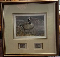 Front view of framed Robert Bateman print showing main Canada goose image and two smaller images