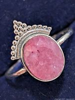 front view of sterling silver ruby ring with beaded crown detail