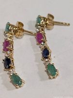 Front view of both earrings showing gemstone arrangement