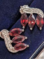 Front view of pair showing garnets and pavé accents