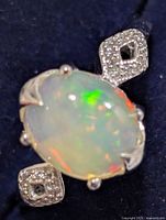 Top view of ring showing opal and CZ shoulders