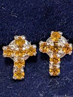 Front view of both cross earrings showing stone arrangement