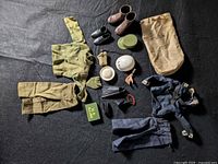 Full lot overview showing uniforms, footwear, helmets, bag and accessories spread on black backdrop