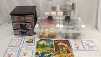 Overall lot showing storage cases, drawer unit, spools, patch cards and needle books