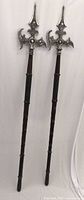 Full view of both halberds showing complete length and matching design