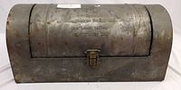 Full view of galvanized steel bread box with domed lid and latch