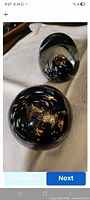 Both paperweights showing forms and internal coloration