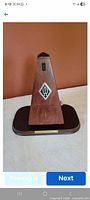 Front view of metronome on base showing Wittner logo