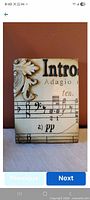 Front view of Sid Dickens Adagio block showing musical score design