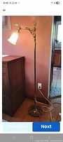 Full view of floor lamp showing height, base, and cord