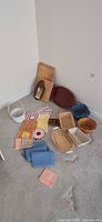 Full lot showing baskets, boards, tray, linens and napkin rings on floor