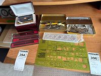 Entire lot showing tins, technical pens, templates, card holder