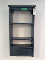 Front view of painted wood wall shelf