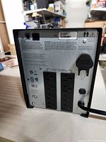 Rear panel showing eight outlets, battery connector, power cord