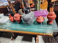 Group shot of all six items on glass table