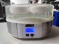 Dash yogurt maker powered on displaying timer