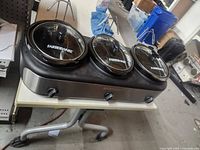 Full view of Farberware triple slow cooker on table