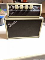 Front view of cream Fender Mini Tone Master amp showing controls and grille