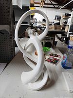 Front view of white porcelain Angel Heart statue