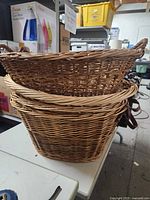 Stack of four wicker baskets showing size variation