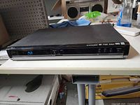 Front view showing Blu-ray logo and control buttons