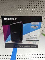 Front of retail box showing Netgear Nighthawk AC1900 WiFi Cable Modem Router