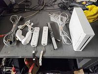 Console, controllers, sensor bar, AV cable, stand