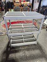 Full view of three-tier plastic rack shelf