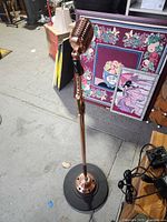 Full view of standing microphone with base