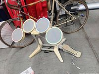 Full view of four-pad Rock Band drum kit on stand