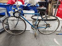 Full left-side view of blue Schwinn World Sport bicycle