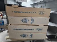 Stack of three World Doll shipping boxes, limited edition labeling visible