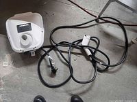Wall-mount Siemens VersiCharge unit with cable and plug on floor