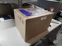 Sealed corrugated shipping box on table