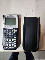 Front view of calculator and cover