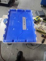 blue plastic tote with lid closed