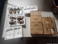 Foam trays with Jim Shore ornaments and branded outer sleeve