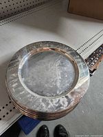 Stack of Towle silver-plated plates top view showing overall condition