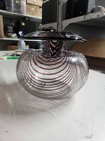 Side view of swirled art glass vase