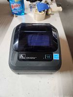 Top view of Zebra GK420d printer showing label slot and model markings