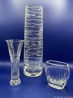 Three crystal vases grouped together